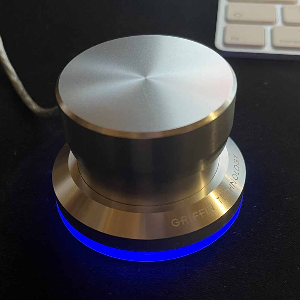 Photo of the Griffin Powermate. The base is illuminated by a nice blue light.