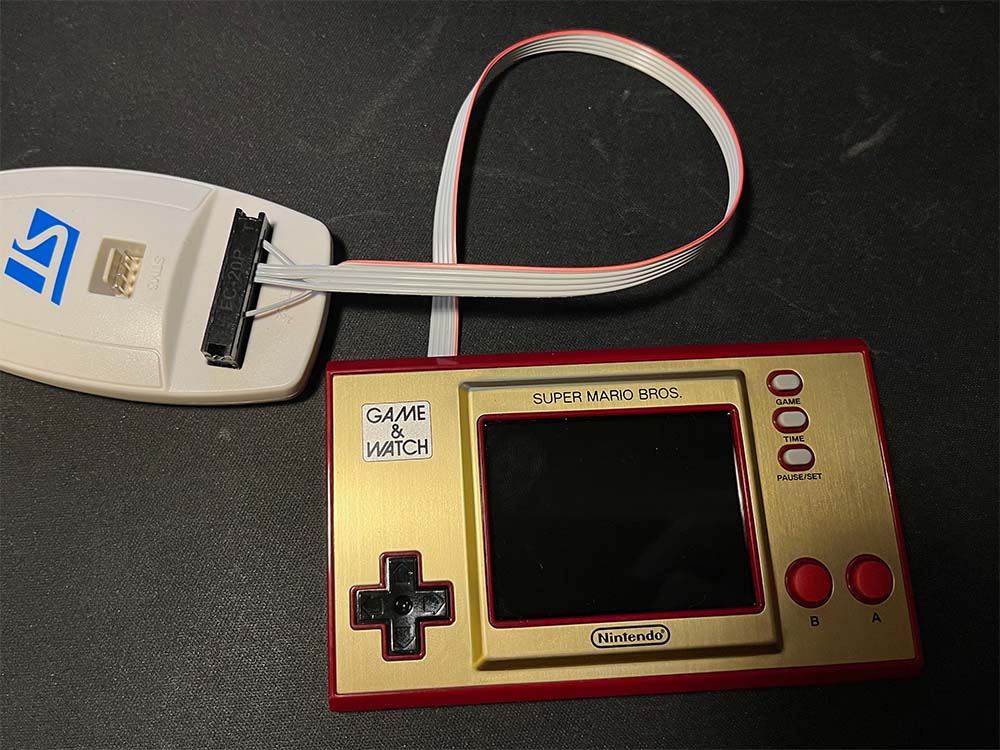 Cable plugged in to the Game and Watch and the ST-link programmer